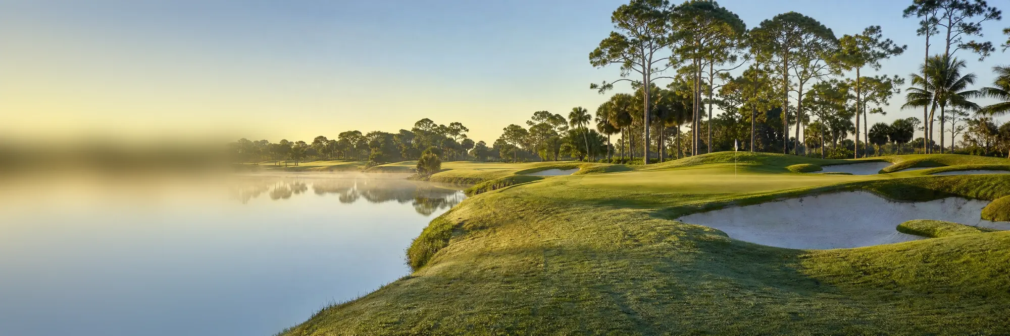 Morning mist over a championship golf course.