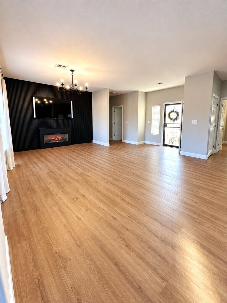 After: Living Room Flooring & Fireplace Wall