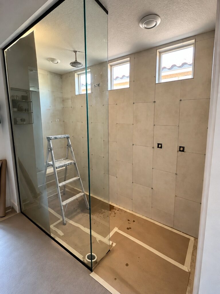 Before: Gray Stone-Look Shower