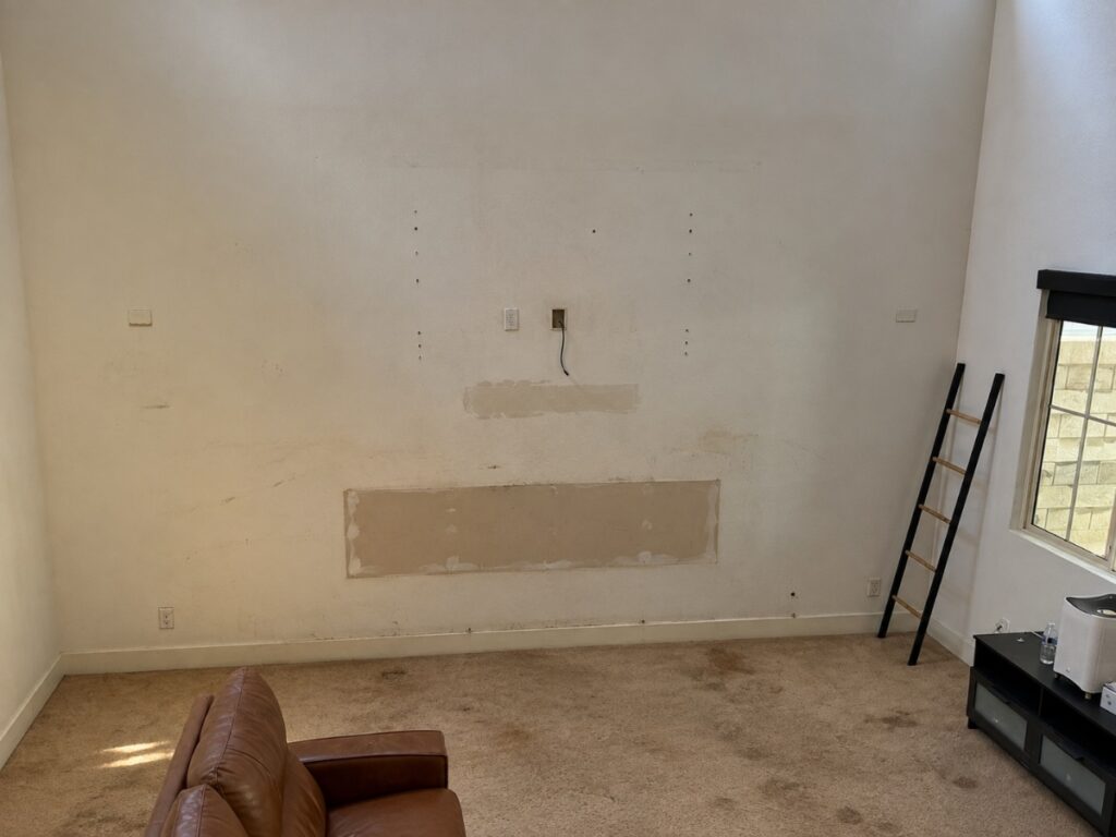 Before: Stacked Stone Fireplace Wall