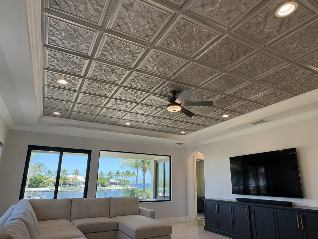 Living room with a metallic tin-look tile ceiling in a tray