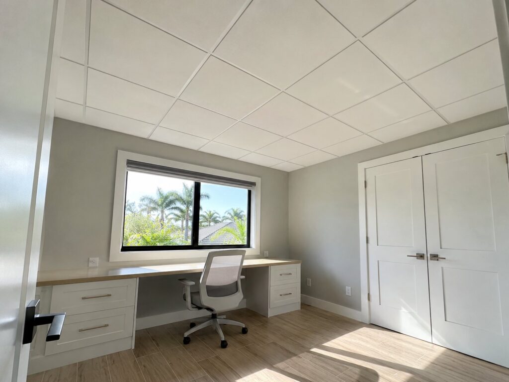 Home office with a white drop ceiling grid