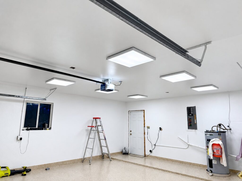 Garage with a smooth white ceiling and LED panel lights