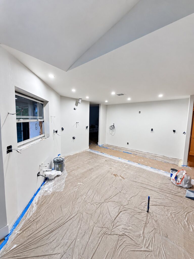 Vaulted room with recessed lights, ready for finishing