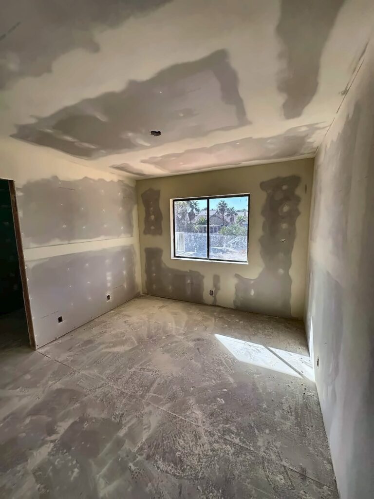 Bedroom with taped and mudded drywall
