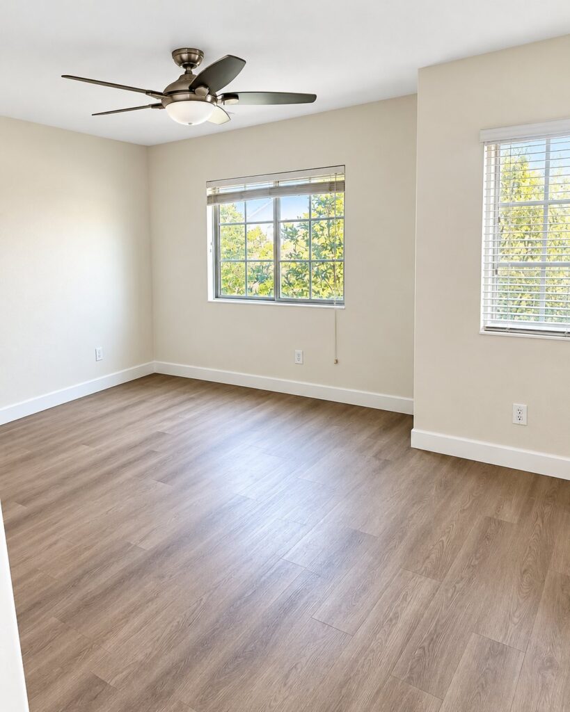 Bedroom with light wood plank flooring