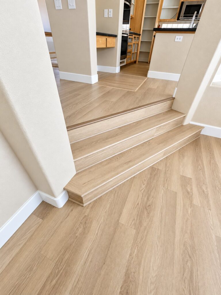 Step-down with matching stair nosing and light oak flooring