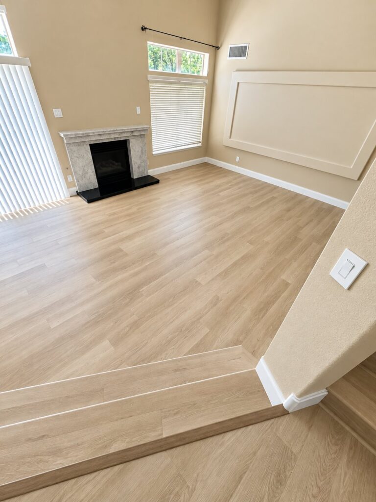 Living room with light oak flooring and a step by the fireplace