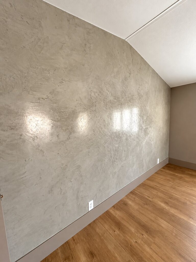 Wall finished in smooth Venetian plaster