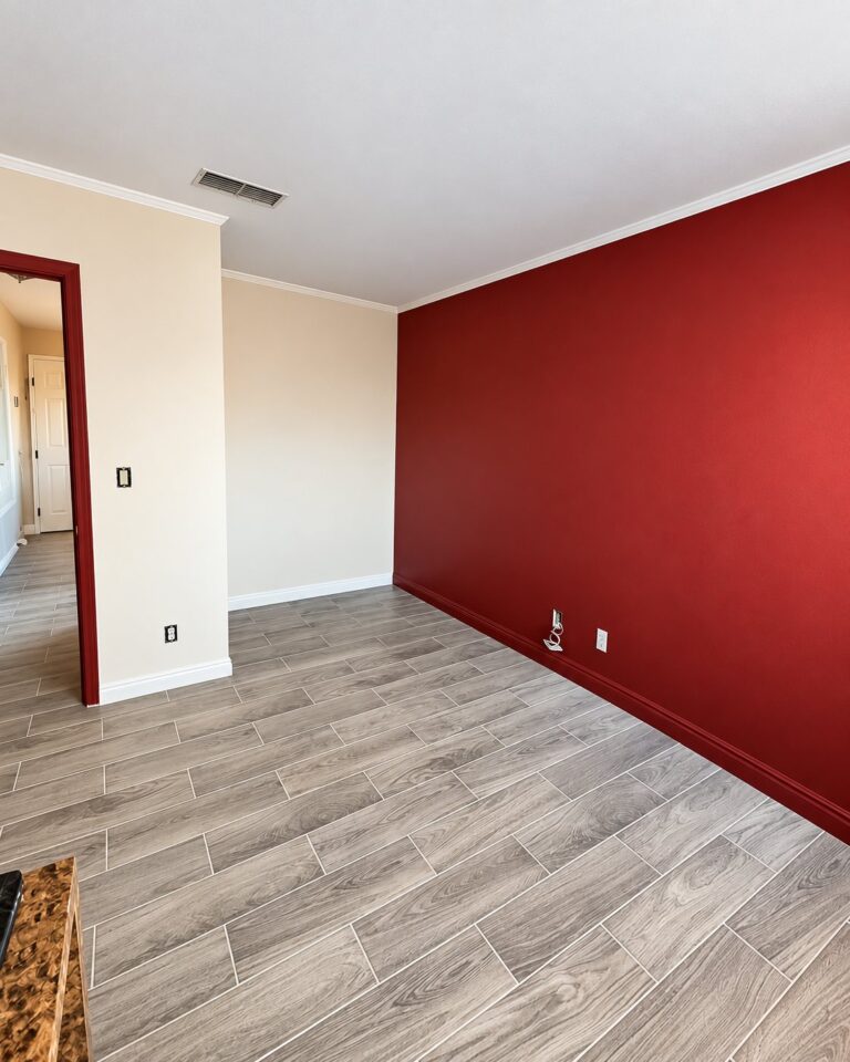 Red accent wall with white trim