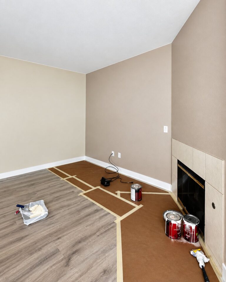 Room prepped for painting with the floor masked and covered