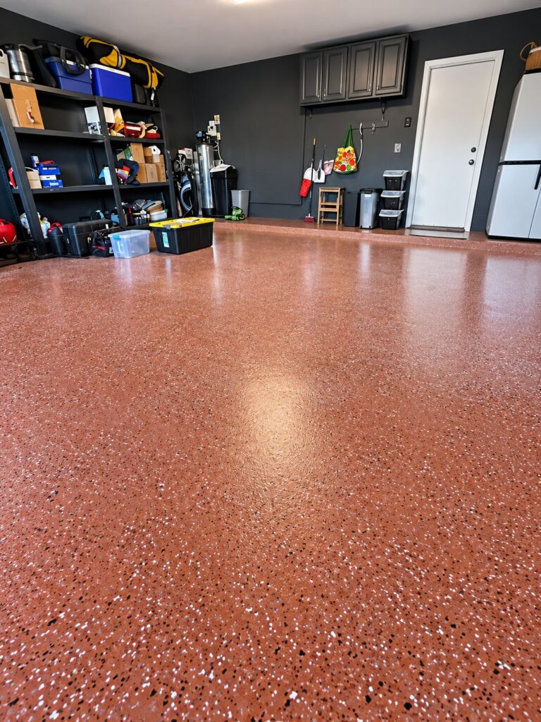 Garage floor finished in a red flake coating