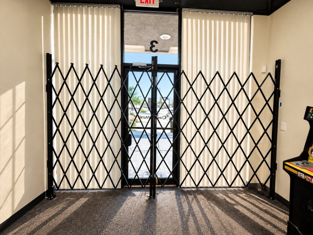 Folding security gates installed at a storefront