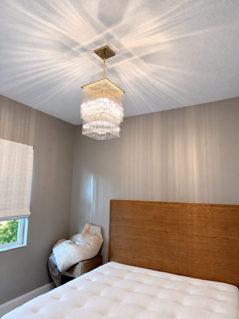 Bedroom with a new crystal pendant light