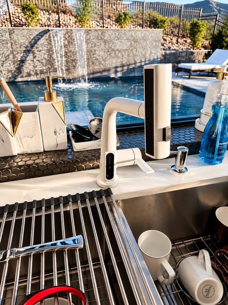 Pull-out kitchen faucet installed at the sink