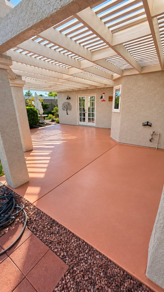 Patio floor coating under a white pergola