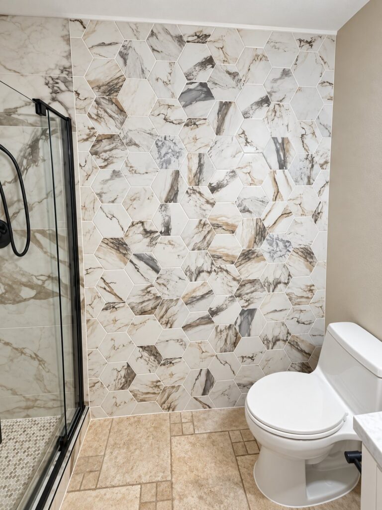 Bathroom wall in large marble-look hexagon tile