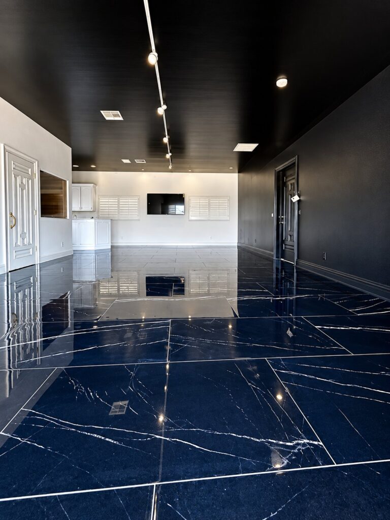 Room with polished navy marble-look floor tile