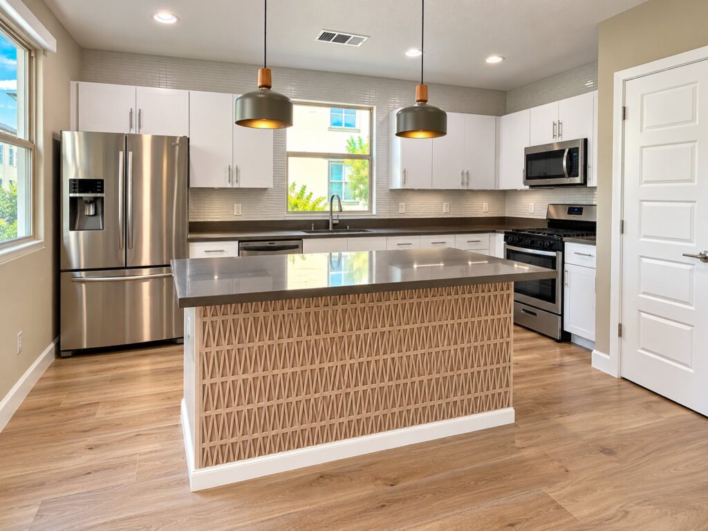 Kitchen island clad in patterned tile