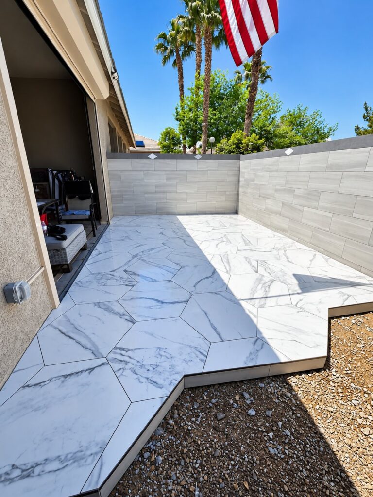 Side yard patio in large white marble-look tile